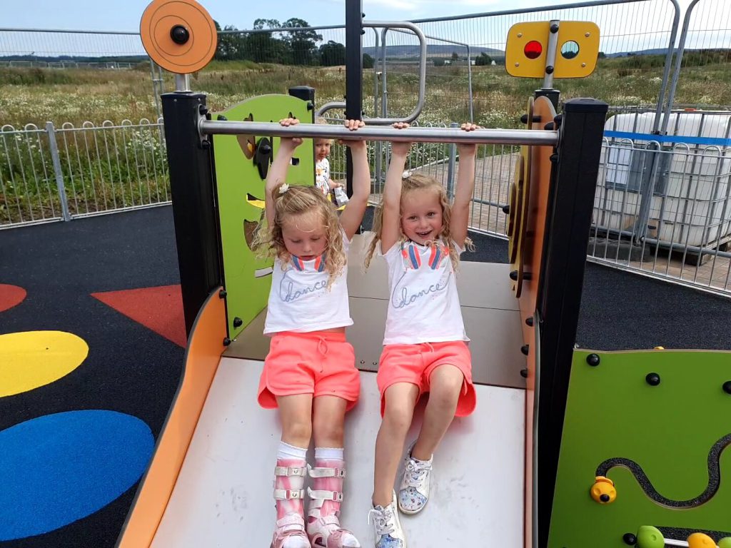 two girls on a kids playwark