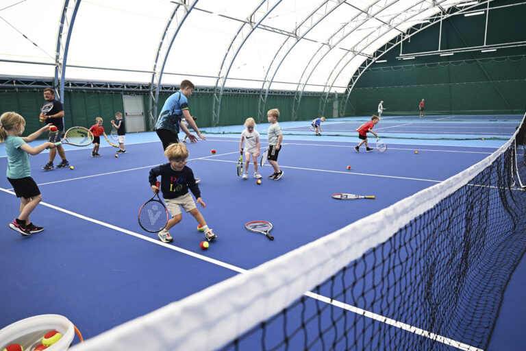 An action shot of the tots tennis coaching sessions at moray sports centre